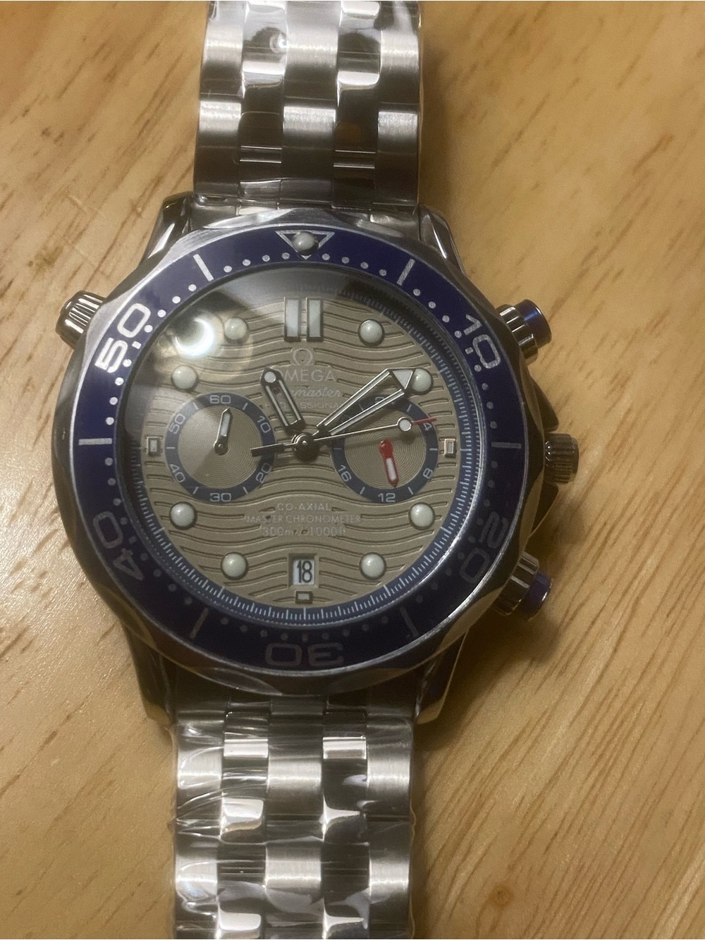 New Men’s Stainless Steel Seamaster Automatic with Blue Bezel and Silver Dial
